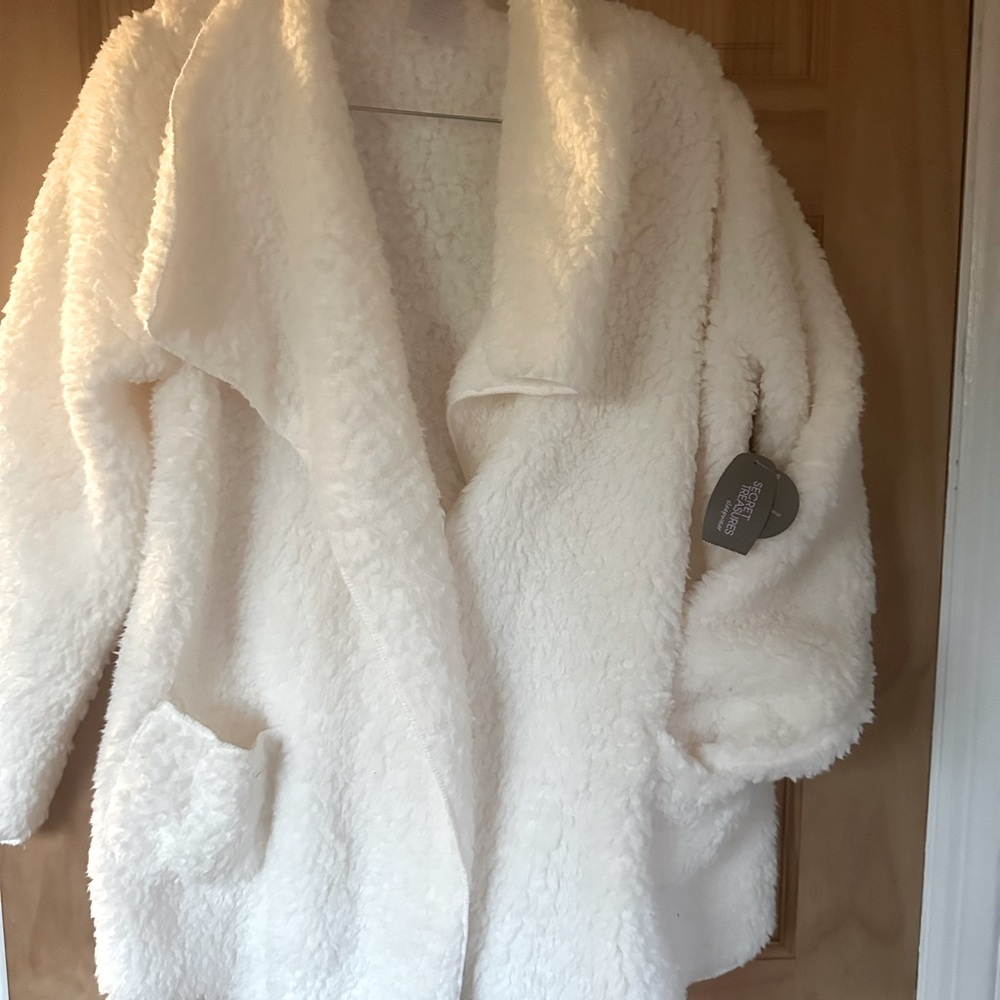 Soft, white slip on throw